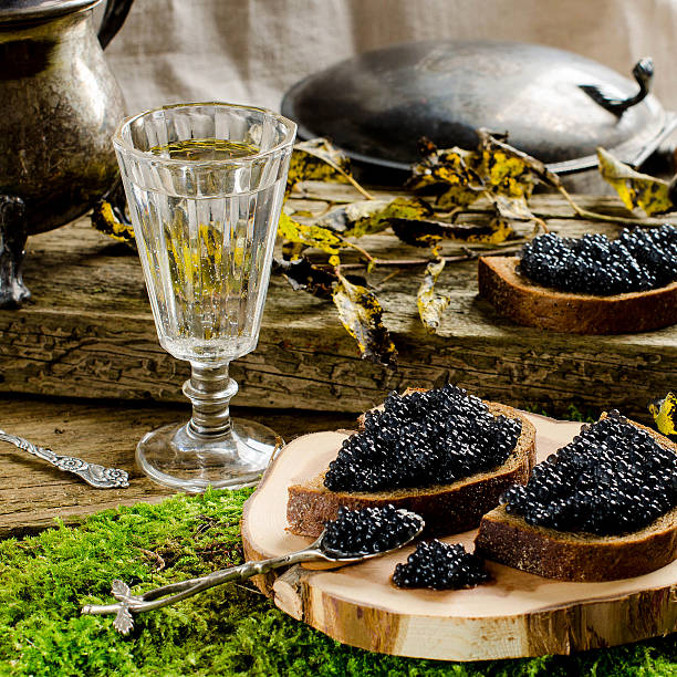 istock Black caviar and vodka. Vintage style. 621466728