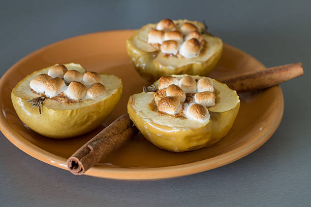 istock Appetizing baked apples with cottage cheese, cinnamon and marshmallows 621467762
