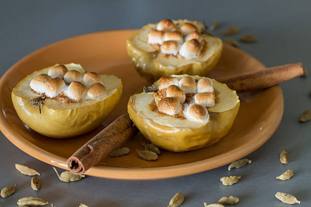 istock Appetizing baked apples with cottage cheese, cinnamon and marshmallows 621467776