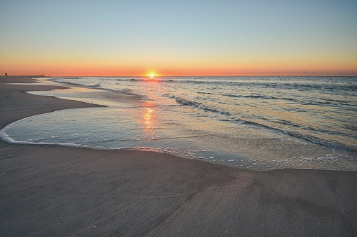 A beautiful sunrise lights up Jones Beach on Long Island NY.  