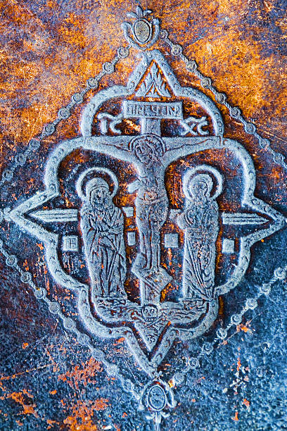 An image of a Christian cross with Jesus Christ and saints.