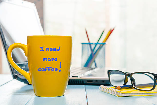 istock I need more coffee written on big yellow cup with 621470566