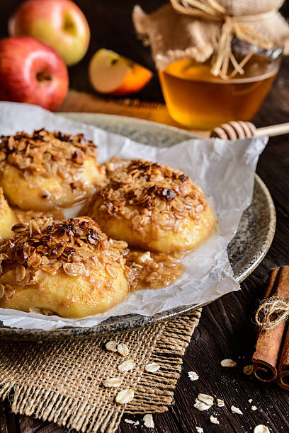 istock Baked apple with oatmeal, walnuts, honey and cinnamon 621470694