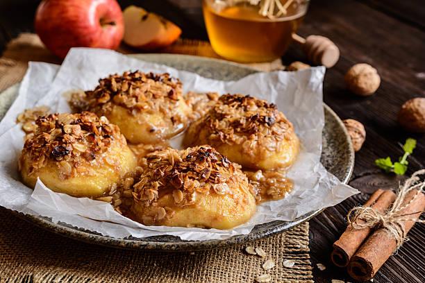 istock Baked apple with oatmeal, walnuts, honey and cinnamon 621470780