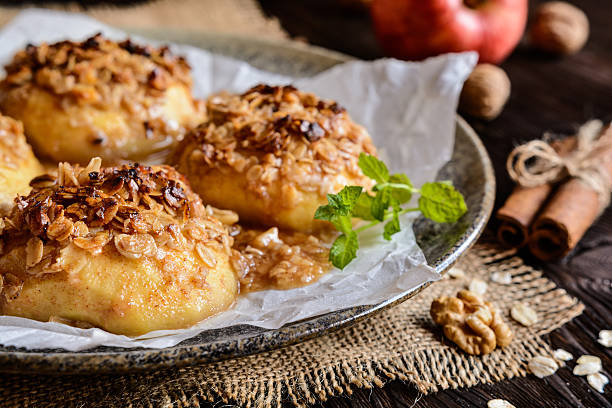 istock Baked apple with oatmeal, walnuts, honey and cinnamon 621470846