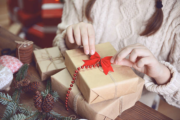 istock girl making Christmas presents 621471246