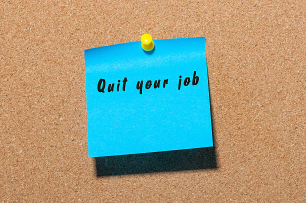 istock Quit your job - inscription on blue sticker pinned at 621472204