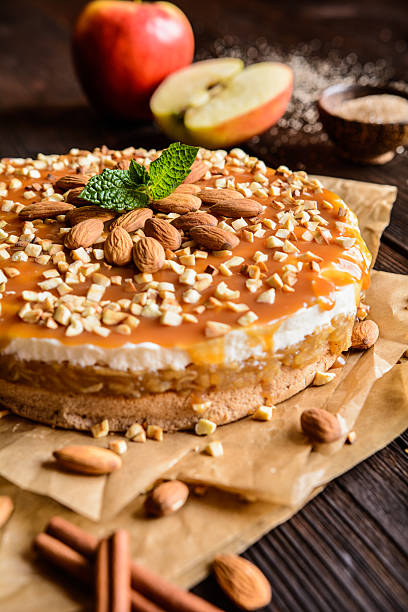 istock Apple cake with whipped cream, caramel and almond topping 621472272