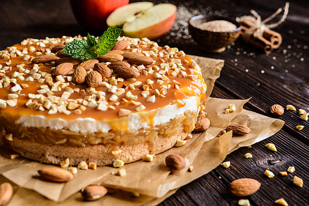 istock Apple cake with whipped cream, caramel and almond topping 621472338