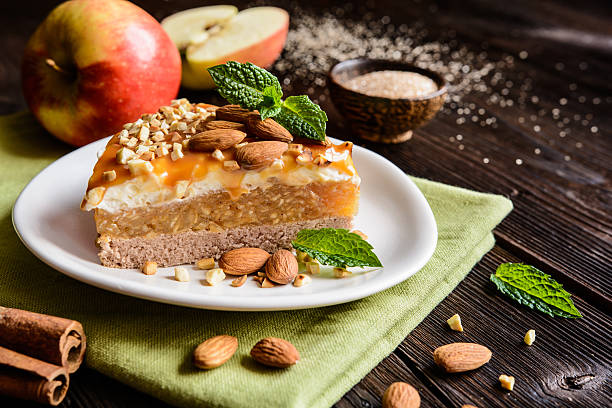 istock Apple cake with whipped cream, caramel and almond topping 621472418