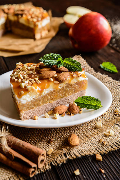 istock Apple cake with whipped cream, caramel and almond topping 621472470