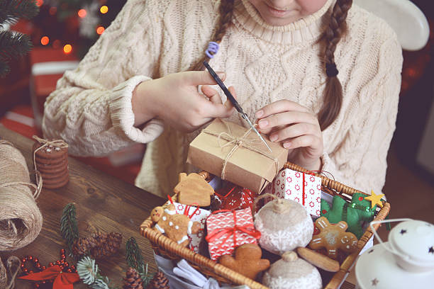 istock girl making Christmas presents 621472692