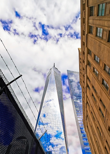 New York City, USA - April 24, 2015: View to One World Trade Center and barbed wire in Lower Manhattan, New York City, USA. It is One WTC in short, or Freedom Tower