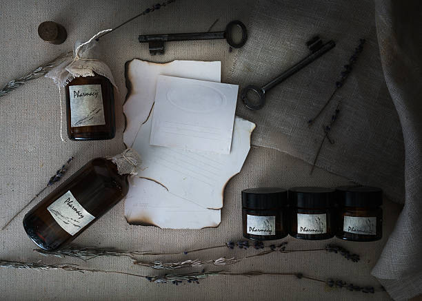 istock Sheets burnt paper, cans and bottles, old keys, dry lavender 621479372