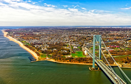 Aerial view on Verrazano-Narrows Bridge over the Narrows. It connects Brooklyn and Staten Island. Narrows is strait connecting Upper Bay with Lower Bay. View on Fort Wadsworth in Staten Island