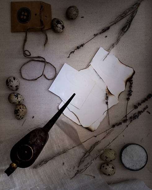 istock Sheets of paper burnt, quail eggs, the old oiler for 621479564