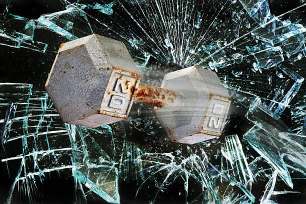 Dumbbell weight through glass.
