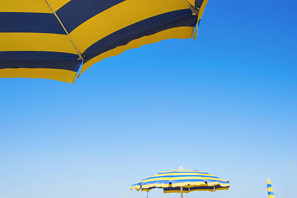 istock Bright colored umbrellas on the beach. 621481528