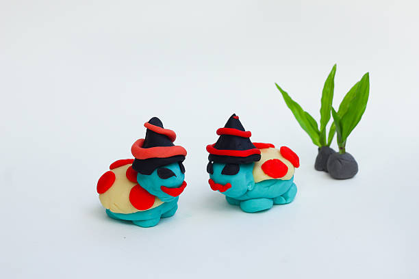 istock Dough molding a Halloween turtle on a white background. 621483674
