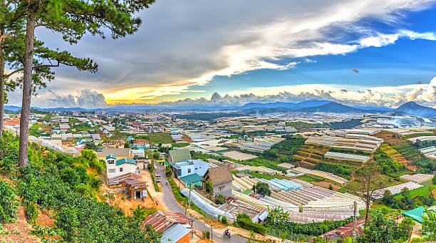 Beauty Da lat highland homes interspersed Beauty Da lat highland homes interspersed with vegetable gardens, planting flowers greenhouse, so far as hill with beautiful pine forests and idyllic in the highlands central highlands vietnam photos stock pictures, royalty-free photos & images