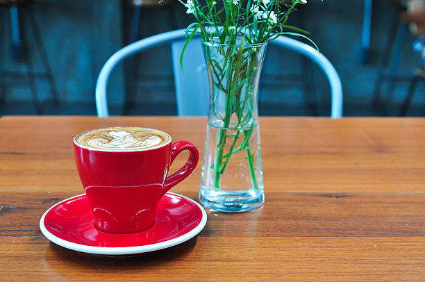 red Cup of coffee on a wooden table Coffee cup in coffee shop,red Cup of coffee on a wooden table,cup of coffee on table in cafe,cup of cappuccino black coffee swirl stock pictures, royalty-free photos & images