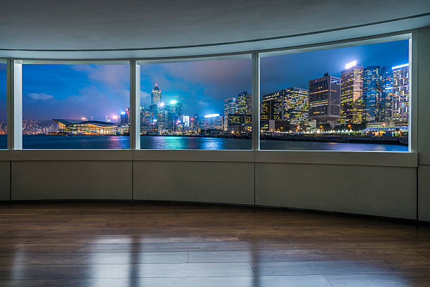 night cityscape and skyline of hong kong from glass window - on the inside looking out imagens e fotografias de stock