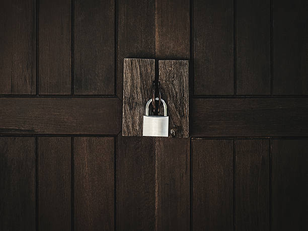 lock on wooden door stock photo