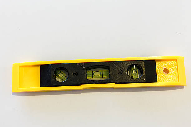 istock Yellow spirit level isolated on white background. 621489104