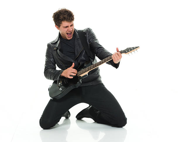 casual homem tocando guitarra - isolated on white studio shot guitar young men - fotografias e filmes do acervo