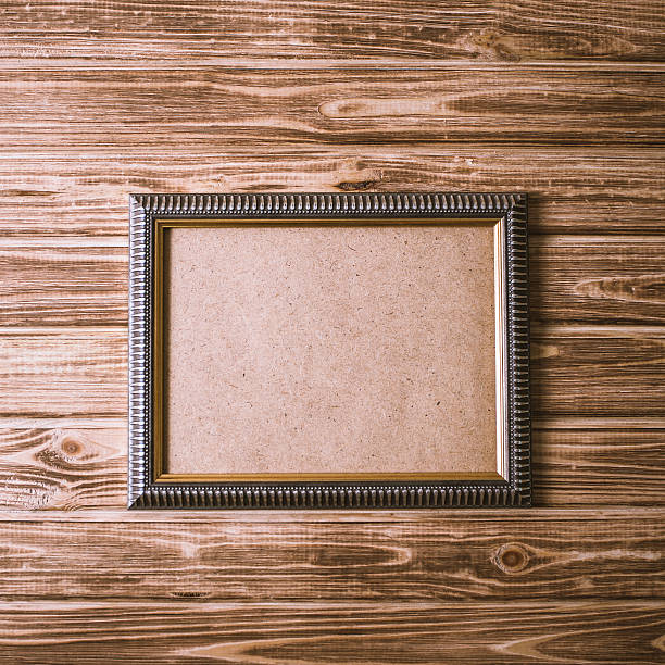 istock vintage photo frame on wooden board background texture 621494540