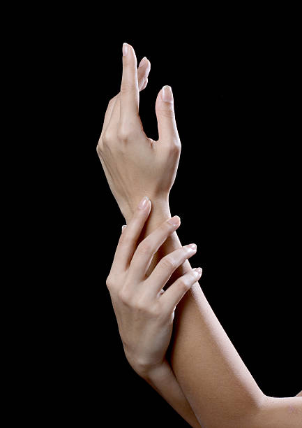 istock beautiful young hands woman isolated on black background 621494872