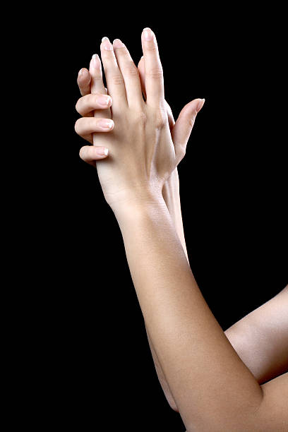 istock beautiful ypung hands woman isolated on black background 621494894