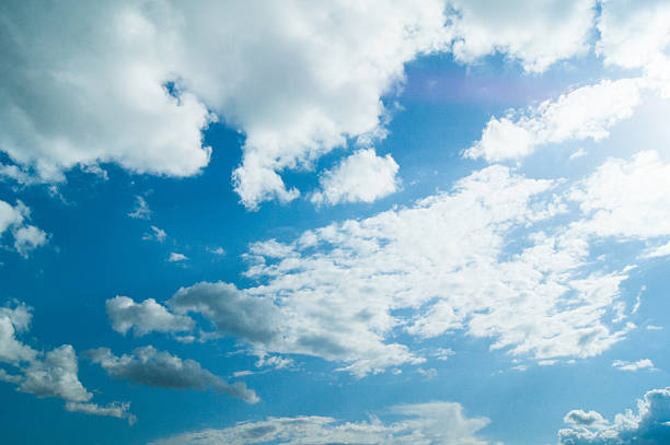 istock Beautiful blue sky with clouds and sun 621496014