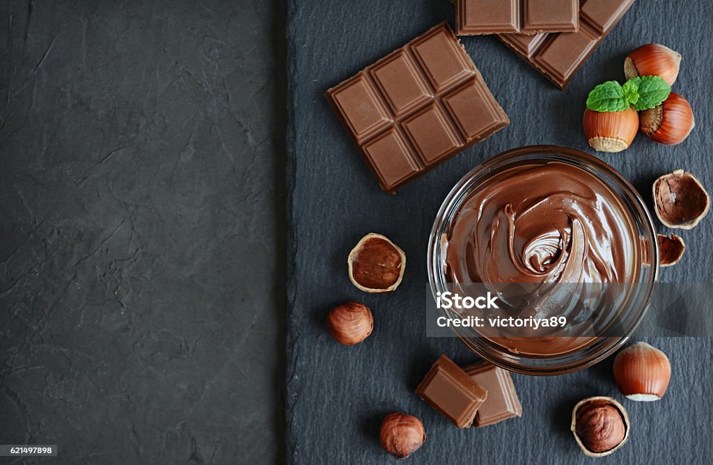 Hazelnut chocolate spread Hazelnut spread with nuts and chocolate bar Chocolate Spread Stock Photo