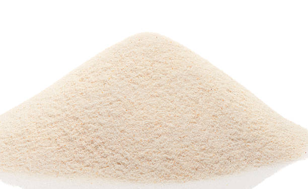 istock Pile of beach sand isolated on white 621498120