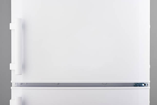 White refrigerator on gray White refrigerator on gray background vehicle door stock pictures, royalty-free photos & images