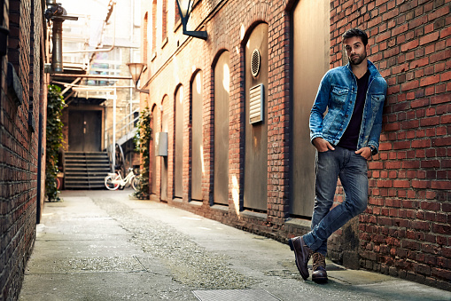 Man standing in street wearing denim, portrait