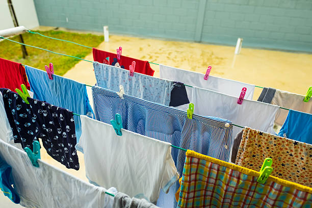 istock Hanging wet clothes during rainy season 621500616