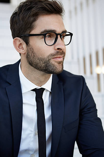 istock Stubble businessman in glasses, close up 621500812