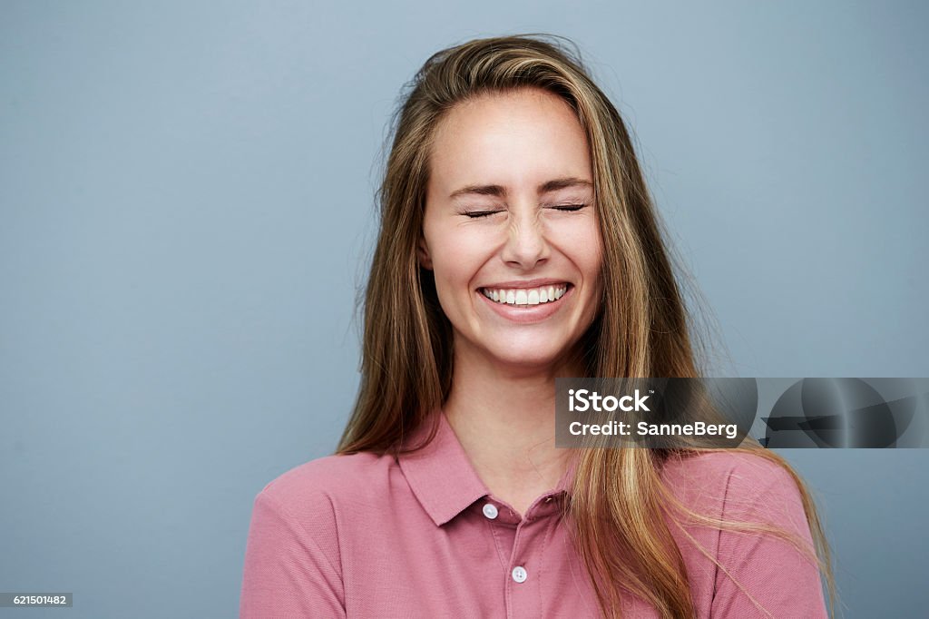 Eyes closed and smiling beautiful woman, studio Eyes Closed Stock Photo