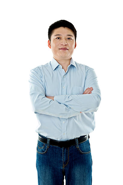 istock Asian businessman standing against white background 621501510