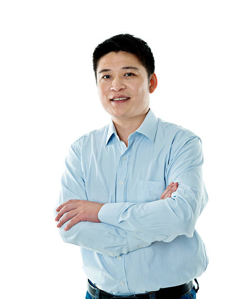 istock Asian businessman standing against white background 621501582