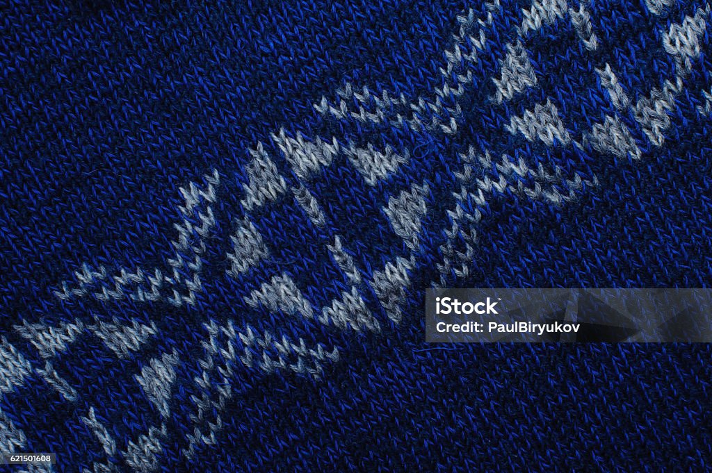 Blau gestrickte Stoff Textur mit weißen Ornamenten - Lizenzfrei Blau Stock-Foto