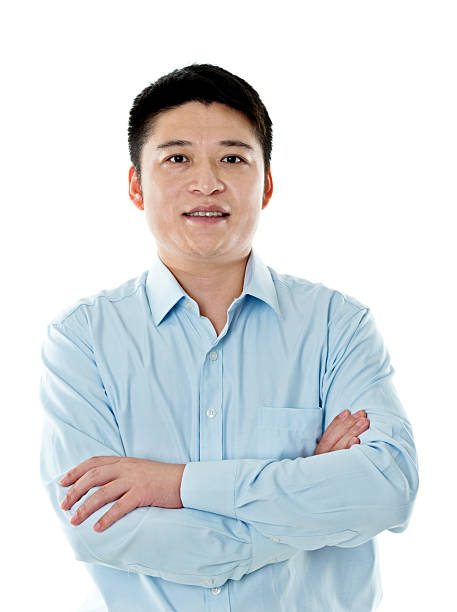 istock Asian businessman standing against white background 621501626