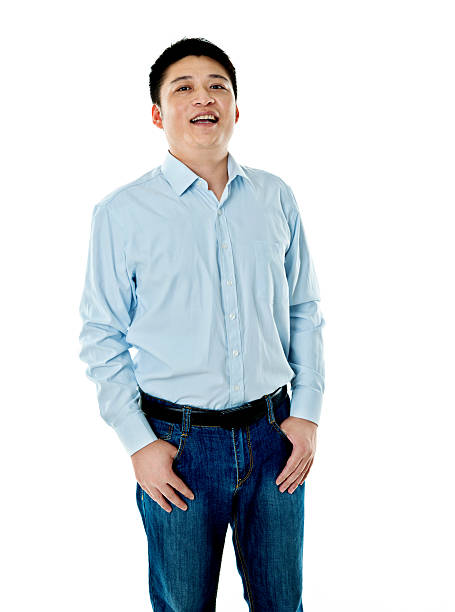 istock Asian businessman standing against white background 621501738