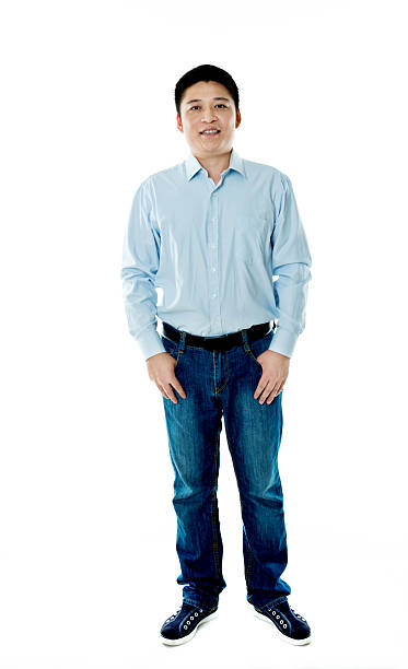 istock Asian businessman standing against white background 621501772