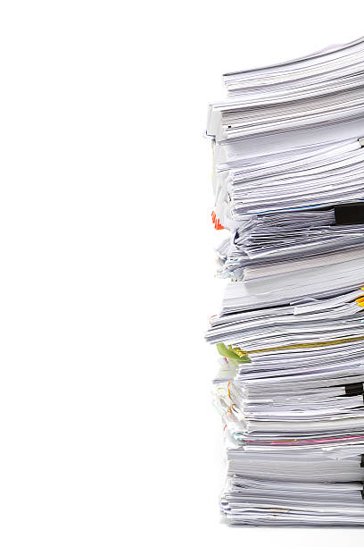 istock Stack of business papers isolated on white background 621501884