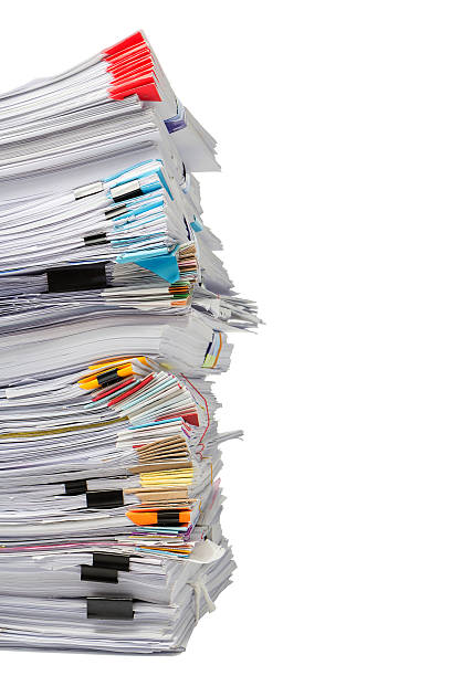 istock Stack of business papers isolated on white background 621501920