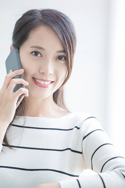 istock beauty woman talk on phone 621503340