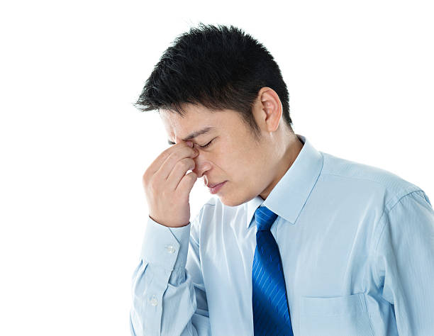 istock Young businessman with headache 621504038